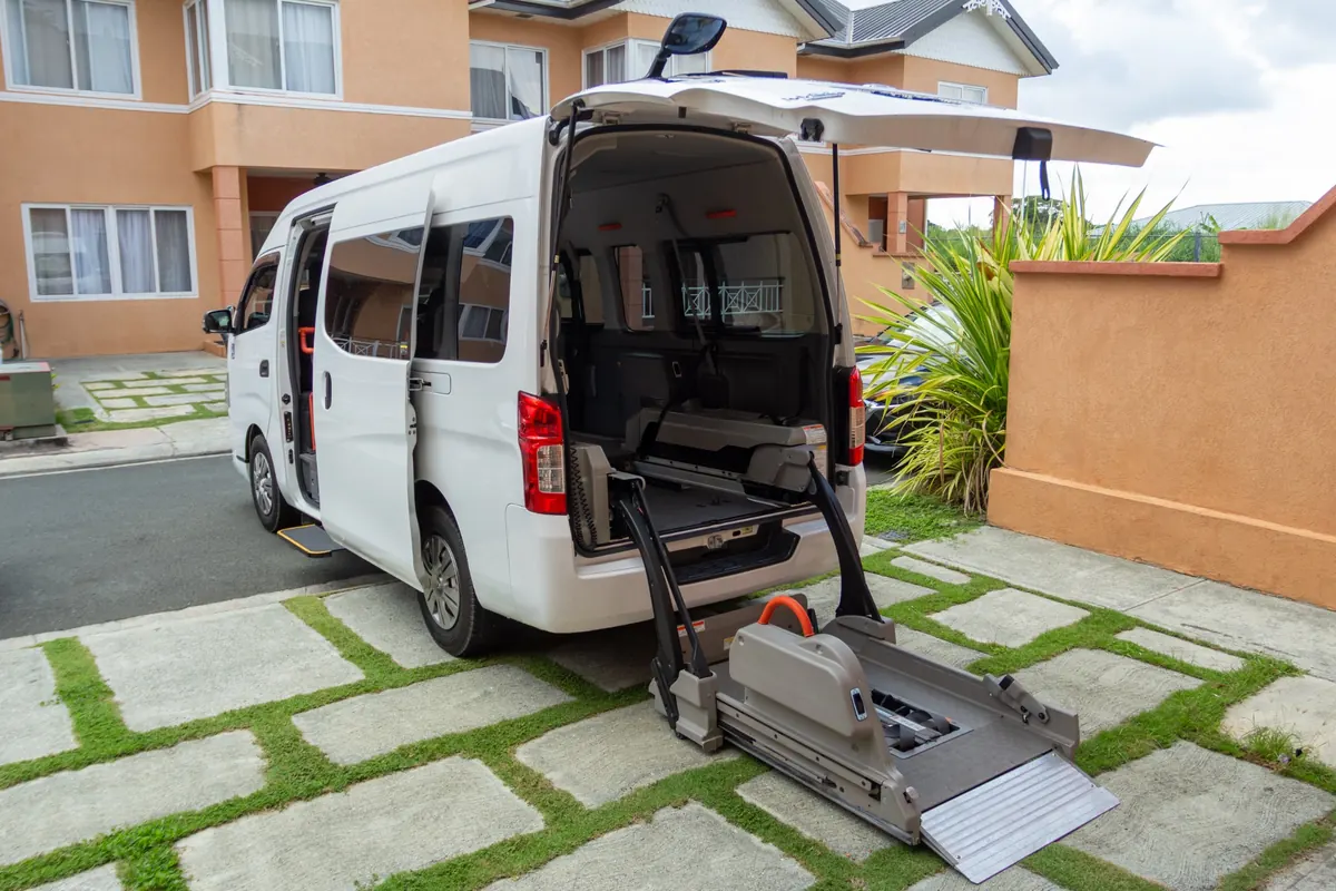 Wellness Express wheelchair-accessible Nissan NV350 with its powered rear lift deployed